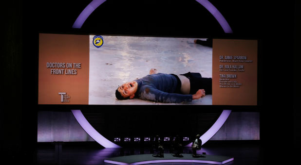 An image of a Syrian man dying from a suspected Syrian government chemical attack is shown on the screen during a panel speaking about the difficulties of doctors working in Syria during the opening night of the Women In The World Summit in New York, U.S.