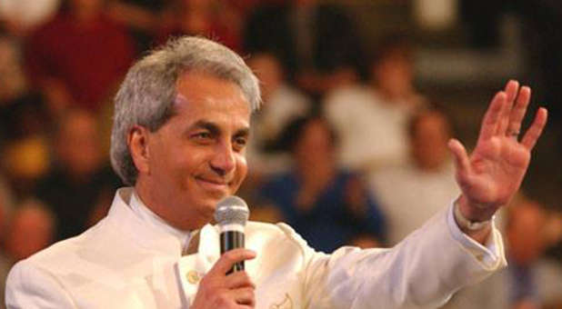 Federal agents raided the Texas headquarters of televangelist Benny Hinn while he was abroad in Paris.
