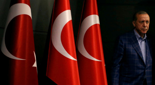 Turkish President Recep Tayyip Erdogan arrives at a news conference in Istanbul