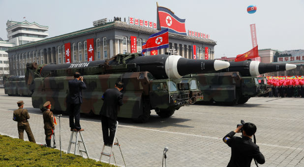 Missiles are driven past the stand with North Korean leader Kim Jong Un and other high ranking officials during a military parade marking the 105th birth anniversary of country's founding father Kim Il Sung, in Pyongyang