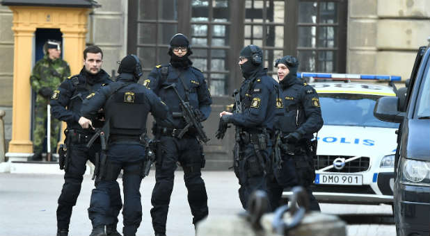 Policemen are seen outside Stockholm Castle after several people were killed and injured after a truck crashed into a department store Ahlens in central Stockholm, Sweden.