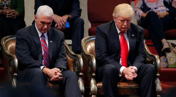 President Donald Trump and Vice President Mike Pence praying
