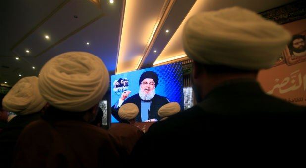 Lebanon's Hezbollah leader Sayyed Hassan Nasrallah addresses his supporters through a screen during a rally commemorating the annual Hezbollah Martyrs' Leaders Day in Jebshit village, southern Lebanon.