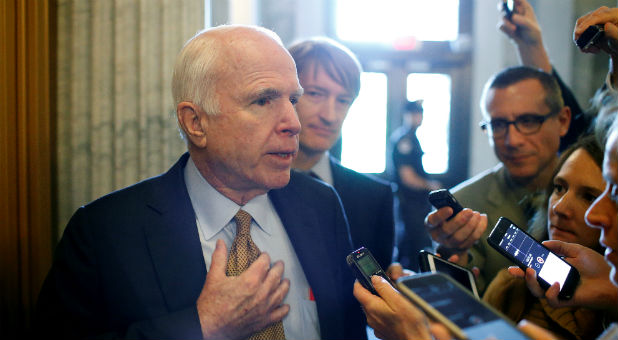 Sen. John McCain speaks to reporters at the U.S. Capitol.