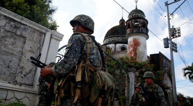 Philippine Marines stand guard outside a mosque in Marawi City in southern Philippines