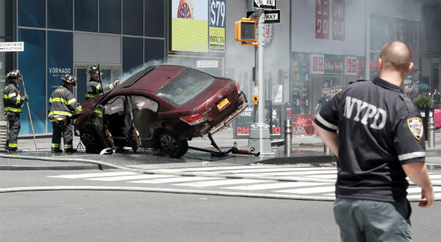 A vehicle that struck pedestrians and later crashed is seen on the sidewalk in Times Square in New York City.