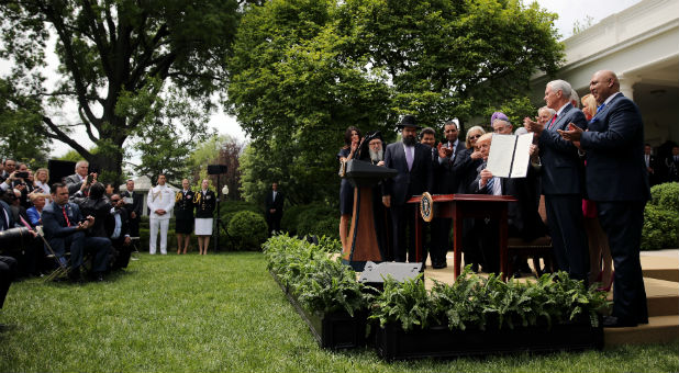 U.S. President Donald Trump shown an executive order on promoting free speech and Religious Liberty during a National Day of Prayer event at the Rose Garden of the White House