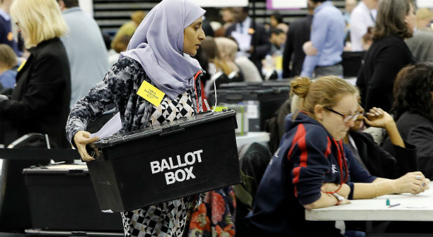 A ballot box is carried during the West Midlands mayoral election count in Birmingham, Britain
