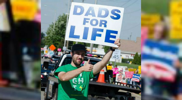 A father protests abortion.