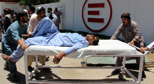 A man is transported to a hospital on a gurney after a car bomb attack in Lashkar Gah, Helmand province, Afghanistan.