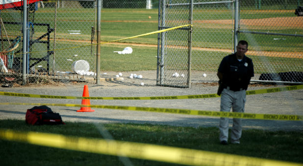 A police officer mans a shooting scene after a gunman opened fire on Republican members of Congress during a baseball practice near Washington in Alexandria, Virginia..