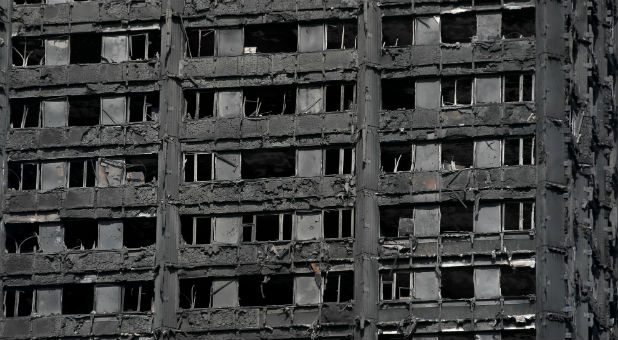 Extensive damage is seen to the Grenfell Tower block, which was destroyed in a fire disaster, in north Kensington, West London.