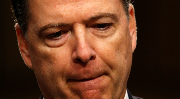 Former FBI Director James Comey pauses as he testifies before a Senate Intelligence Committee hearing on Russia's alleged interference in the 2016 U.S. presidential election.