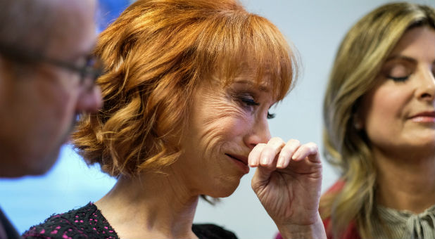 Comedian Kathy Griffin (C) cries during a news conference.