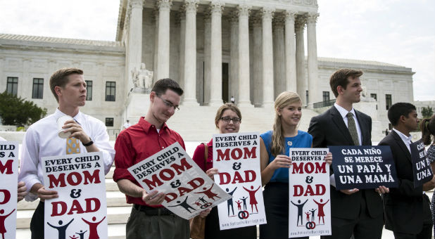 Protestors opposed to gay marriage rally in front of the Supreme Court in Washington June 25, 2015.