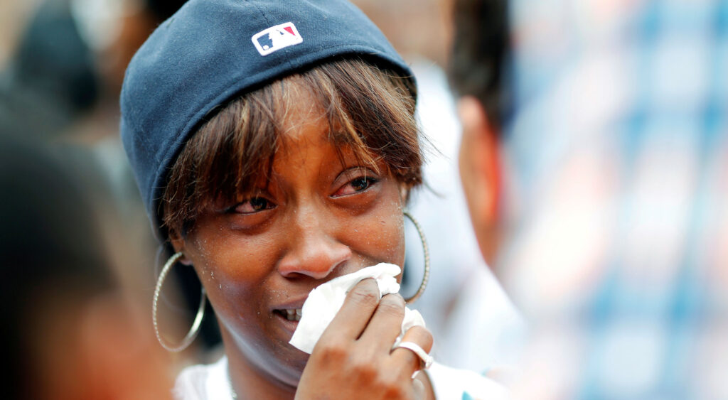 Diamond Reynolds, girlfriend of Philando Castile, weeps as people gather to protest the fatal shooting of Castile by Minneapolis area police during a traffic stop on Wednesday, in St. Paul, Minnesota, on July 7, 2016.
