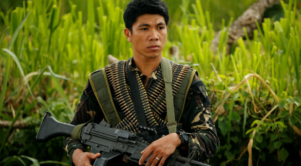 A Philippines army soldier guards a road during an operation to retrieve bodies of victims from the fighting zone in Marawi City, Philippines June 28, 2017.