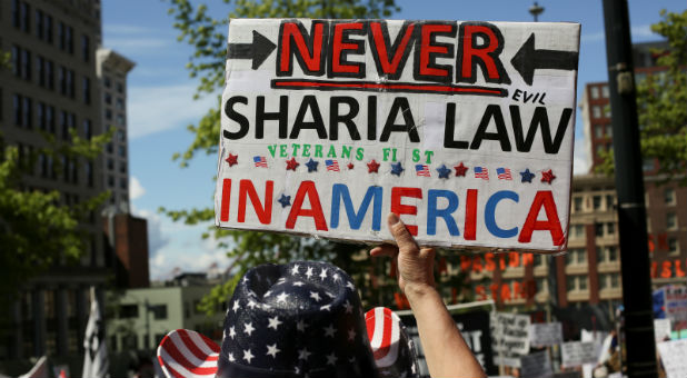 A protester holds a sign during an anti-Sharia rally in Seattle.