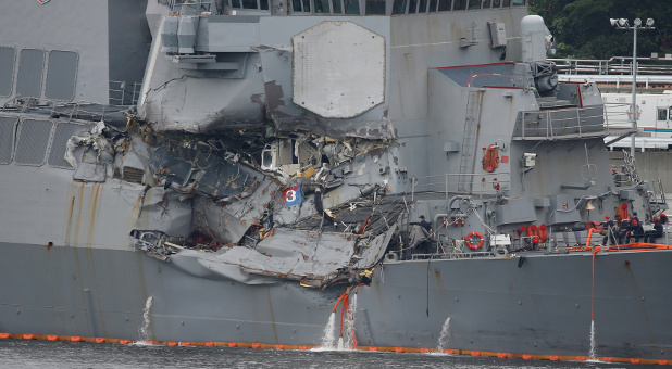 The Arleigh Burke-class guided-missile destroyer USS Fitzgerald, damaged by colliding with a Philippine-flagged merchant vessel, is seen at the U.S. naval base in Yokosuka, Japan.
