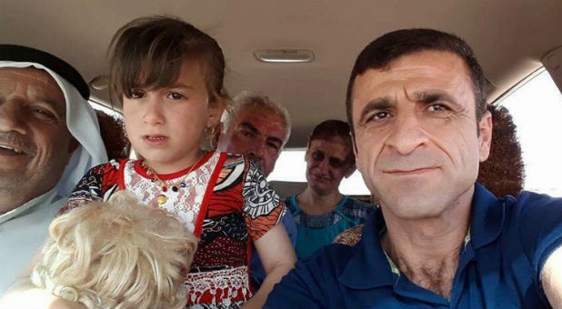 Five-year-old Christina, in captivity for three years, is reunited with her family, including mother Ayda in the back.