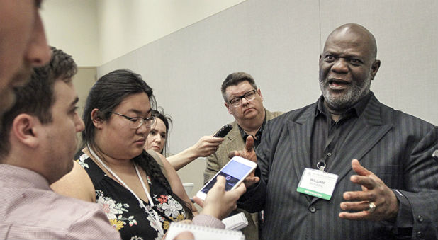 The Rev. Dwight McKissic, pastor of Cornerstone Baptist Church in Arlington, Texas, speaks with reporters after a resolution similar to one he submitted June 13 on racism was unanimously approved June 14, 2017. Messengers adopted a resolution