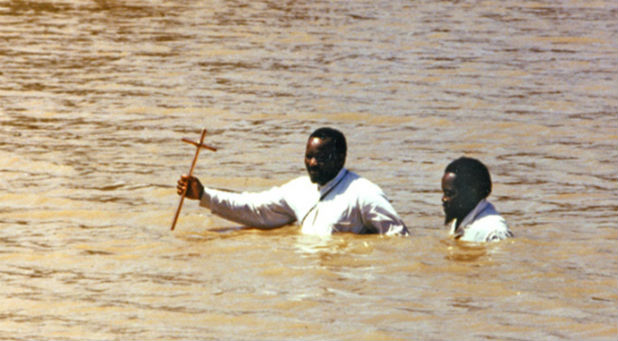 A river baptism in South Africa in 1987. Many charismatic churches in Africa perform baptisms in rivers.