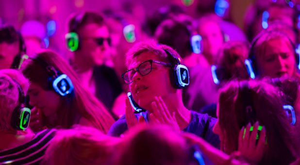 Festivalgoers dance at the silent disco stage during Open'er music Festival in Gdynia, Poland.