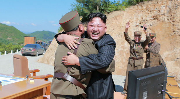 North Korean leader Kim Jong Un reacts with scientists and technicians of the DPRK Academy of Defence Science after the test-launch of the intercontinental ballistic missile Hwasong-14 in this undated photo released by North Korea's Korean Central News Agency.