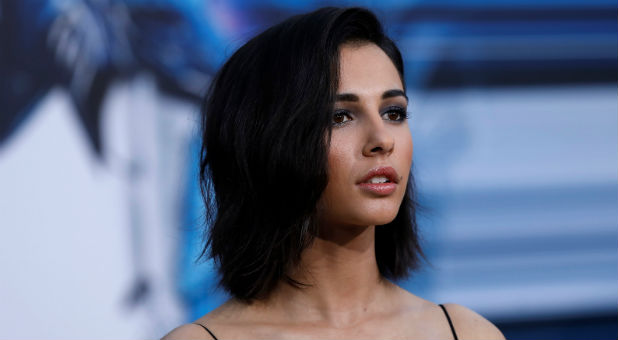 Cast member Naomi Scott poses at the premiere of