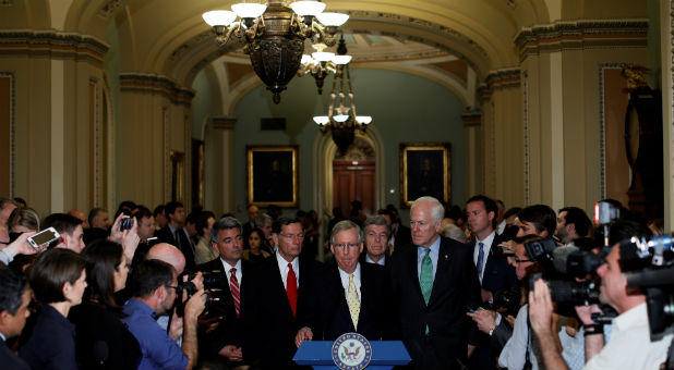 U.S. Senate Majority Leader Mitch McConnell, R-Ky., flanked by Senate Republican Leaders, speaks with reporters about health care legislation after the weekly party caucus luncheons outside the Senate floor at the U.S. Capitol in Washington.