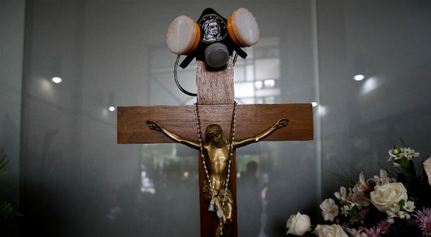 2017 08 Reuters Crucifix Gas mask