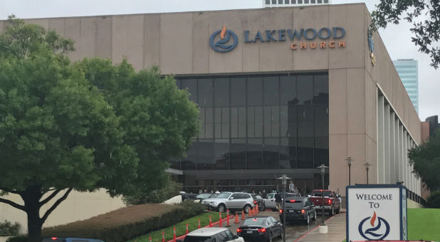 Vehicles queue to deliver supplies for Hurricane Harvey evacuees at the nondenominational Lakewood Church, founded by pastor Joel Osteen, in Houston, Texas, U.S. Aug. 29, 2017.