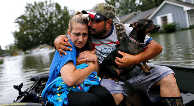 Texas refugees cling to their pets as they search for safety.
