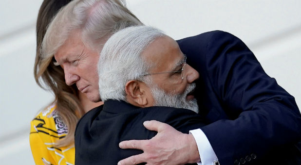 India's Prime Minister Narendra Modi hugs U.S. President Donald Trump as he departs the White House after a visit, in Washington, D.C.