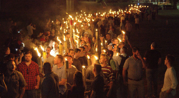 White nationalists carry torches on the grounds of the University of Virginia, on the eve of a planned Unite The Right rally in Charlottesville, Virginia.