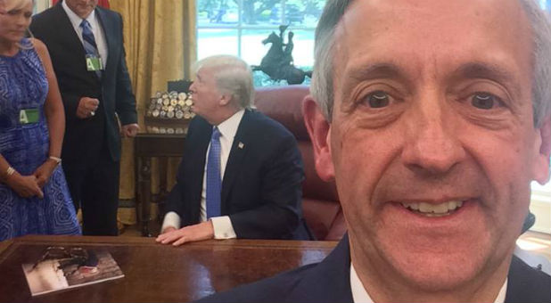 Robert Jeffress, right, snaps a selfie with President Donald Trump.