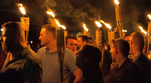 White nationalists carry torches on the grounds of the University of Virginia, on the eve of a planned Unite The Right rally in Charlottesville.