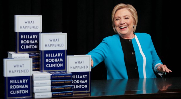 Hillary Clinton poses with her new book.
