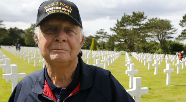 A U.S. veteran visits American War cemetery in Colleville-sur-Mer