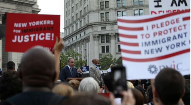 New York Attorney General Eric Schneiderman speaks at a rally protesting the planned dissolution of DACA.
