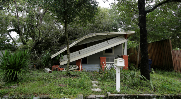 A home damaged by a tree is seen after Hurricane Irma made landfall in Tampa, Florida.