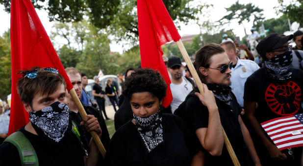 Members of Antifa gather to protest during the Mother of All Rallies demonstration on the National Mall.