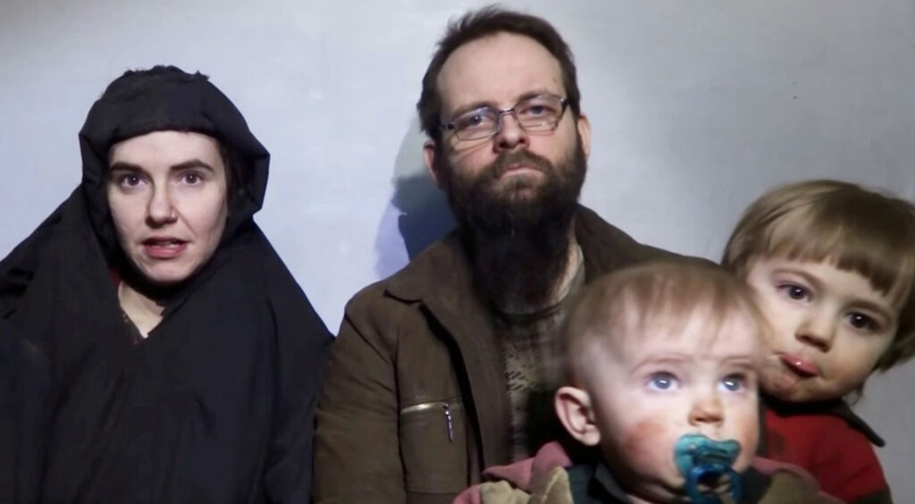 A still image from a video posted by the Taliban on social media on Dec. 19, 2016, shows American Caitlan Coleman (L) speaking next to her Canadian husband Joshua Boyle, and their two sons.