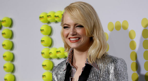 Cast member Emma Stone poses at the premiere for