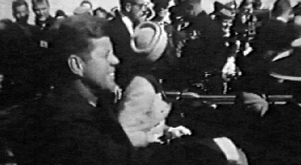 Television footage of President John F. Kennedy and first lady Jacqueline Kennedy are shown in the presidential limousine in the moments before Kennedy was assassinated in Dallas.