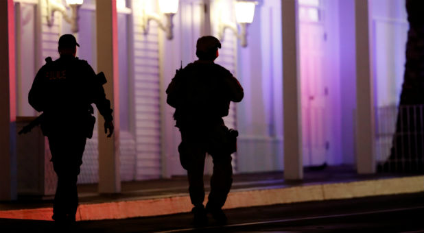 Metro Police officers pass by the front of the Tropicana hotel-casino.