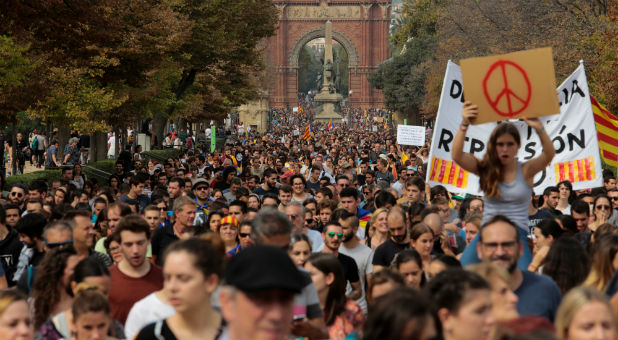 People walk during a demonstration two days after the banned independence referendum in Barcelona, Spain.