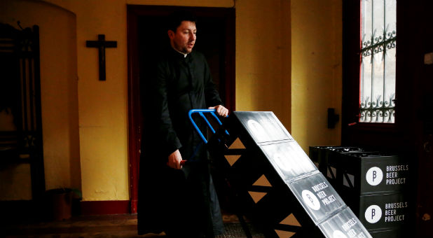 Belgian priest Kurt delivers crates of a new beer called Ste Kat' to restaurants and cafes surrounding the Sainte-Catherine church.