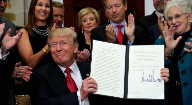 2017 misc Reuters Donald Trump signs executive order
