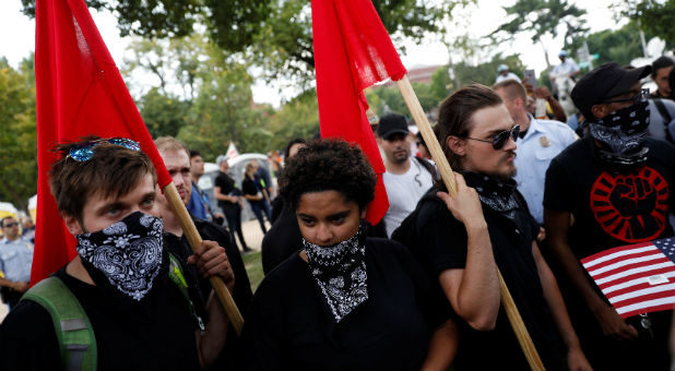 Members of antifa gather to protest during the Mother of All Rallies demonstration on the National Mall.